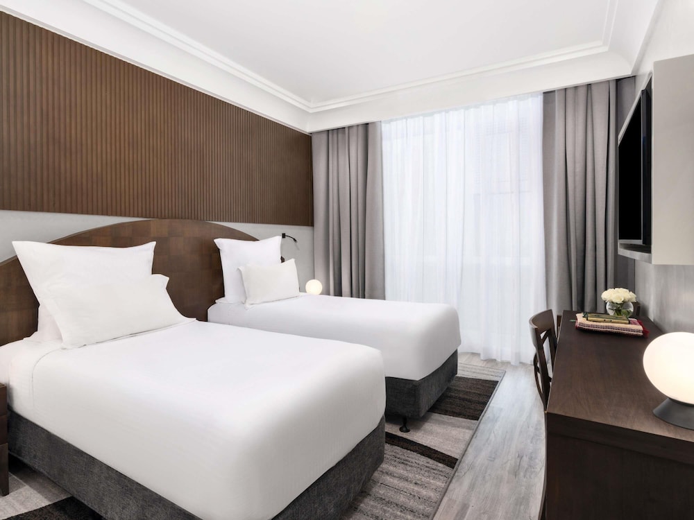 Deluxe Executive Suite, 1 King Size Bed, 2 Single Size Beds, Partial Kaaba View del hotel Pullman Zamzam Makkah. Foto 1