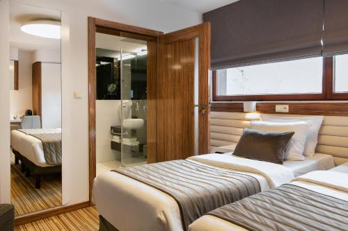 Habitación Doble Confort - 1 o 2 camas del hotel Leonardo Boutique Krakow City Center. Foto 5