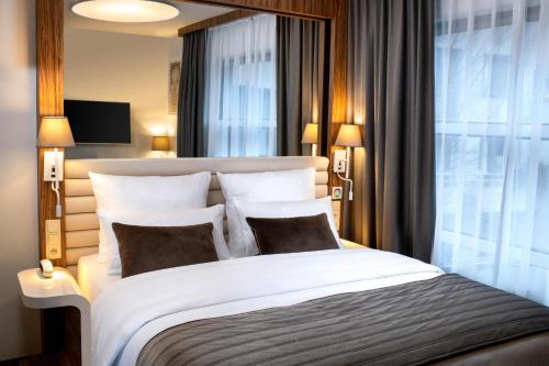 Habitación Doble acogedora del hotel Leonardo Boutique Krakow City Center. Foto 1