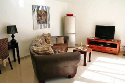 Suite con vistas al jardín del hotel Birdcage Gay Resort - Adult Only. Foto 9