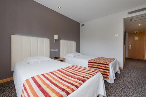 Habitación Doble - 2 camas del hotel Azinheira by RIDAN Hotels. Foto 1