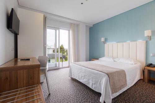 Habitación doble con balcón del hotel Azinheira by RIDAN Hotels. Foto 2