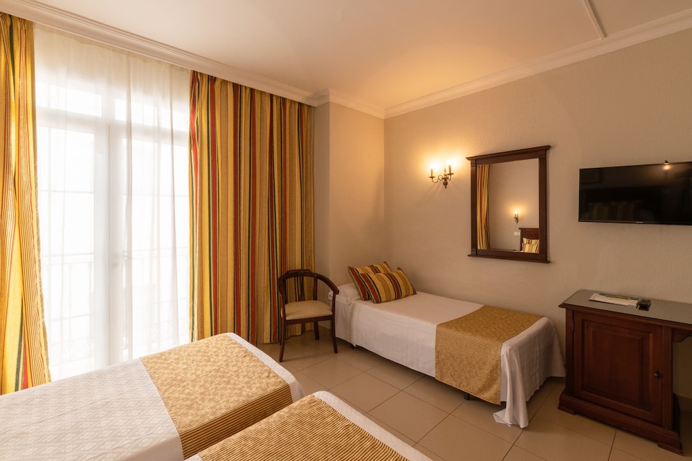 Habitación triple 3 camas individuales del hotel Marte. Foto 4