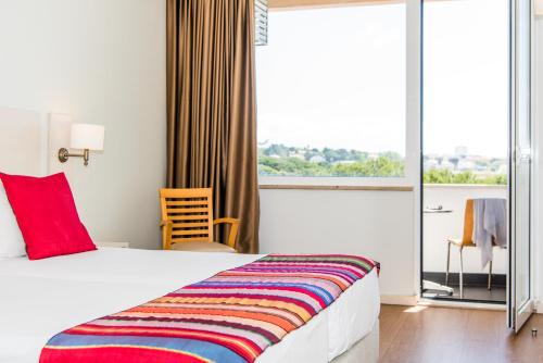 Habitación Doble con balcón del hotel Londres Estoril. Foto 1