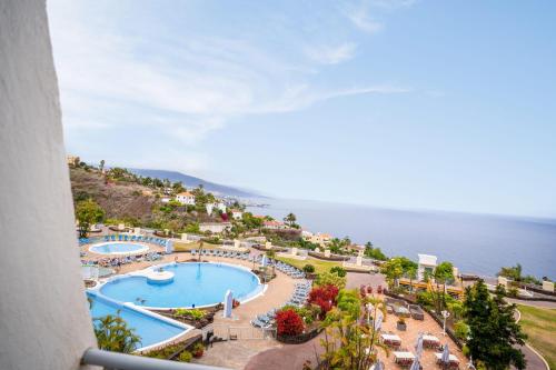 Apartamento de 1 dormitorio con vistas al jardín, a la piscina o al mar del hotel Coral La Quinta Park Suites. Foto 16