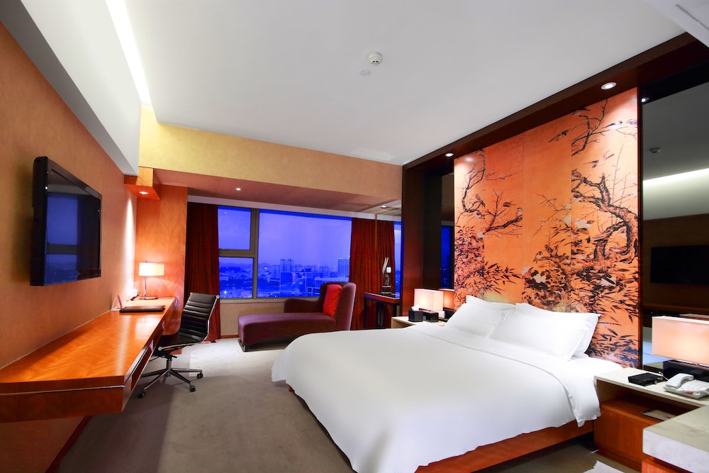 Habitación ejecutiva, 1 cama de matrimonio grande del hotel Grand Mercure Dongguan Humen. Foto 2