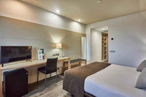 Habitación Doble Confort - 1 o 2 camas del hotel Silken Puerta De Valencia. Foto 2