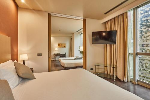 Habitación Familiar del hotel Silken Puerta De Valencia. Foto 9