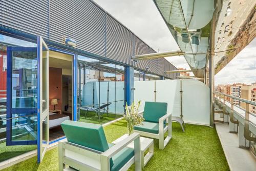 Habitación Doble con Terraza del hotel Silken Puerta De Valencia. Foto 12