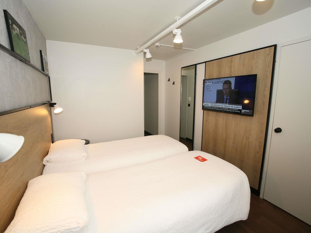 Habitación Standard con dos camas individuales del hotel Ibis Saint Lo La Chevalerie. Foto 7