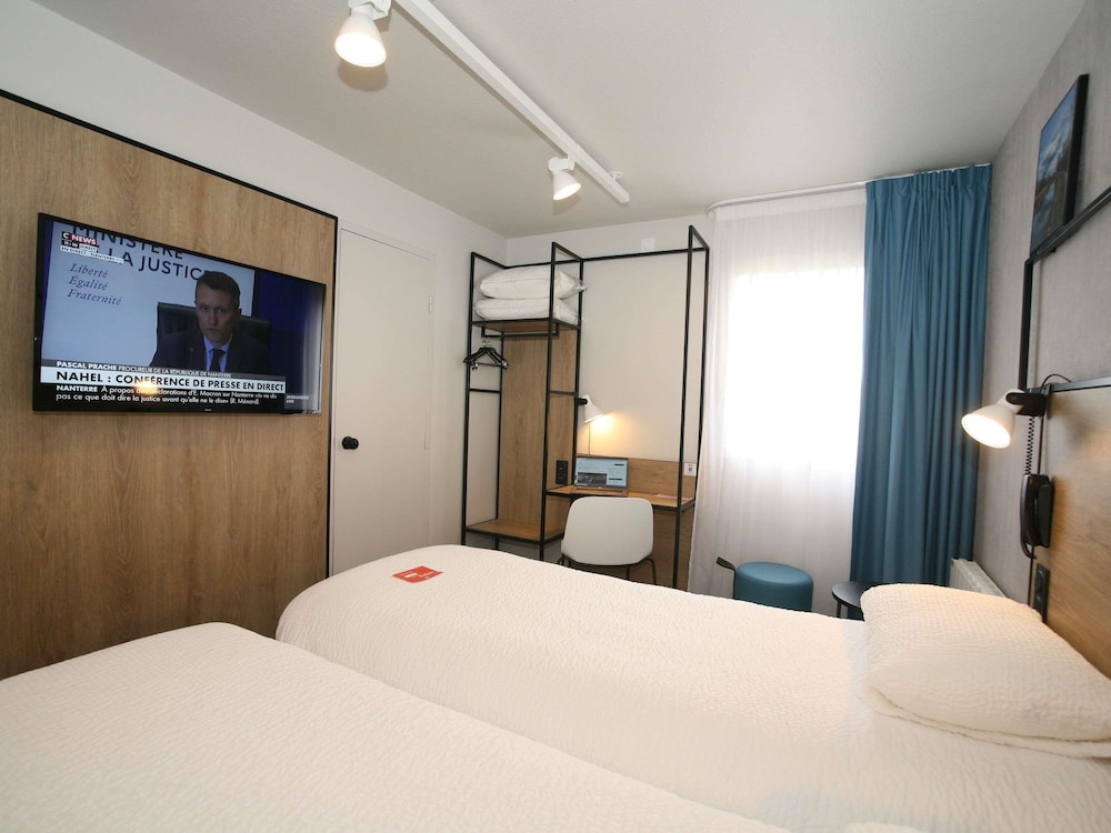 Habitación Standard con dos camas individuales del hotel Ibis Saint Lo La Chevalerie. Foto 8