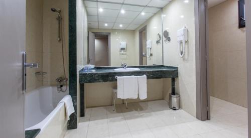 Habitación Triple del hotel Olympia Events and Spa. Foto 1