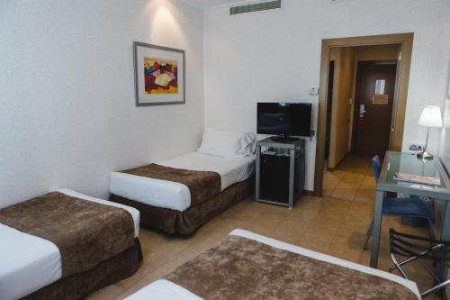 Habitación Triple del hotel Mas Camarena. Foto 2