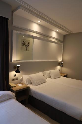 Habitación Doble con cama supletoria del hotel Olid