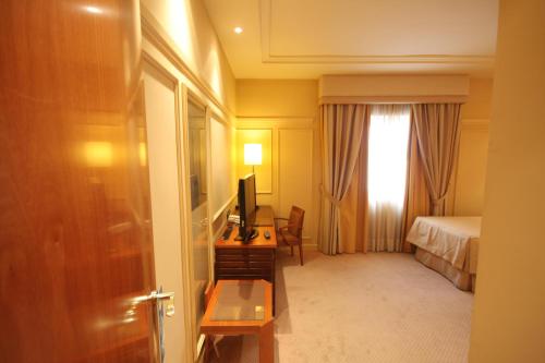 Habitación Doble con cama supletoria del hotel Olid. Foto 5