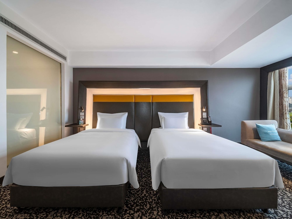 Habitación Superior con Dos Camas Individuales del hotel Novotel Zhengzhou Convention Centre. Foto 1