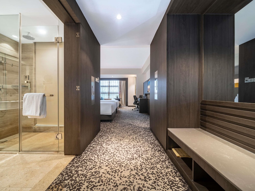 Habitación Superior con Dos Camas Individuales del hotel Novotel Zhengzhou Convention Centre. Foto 7