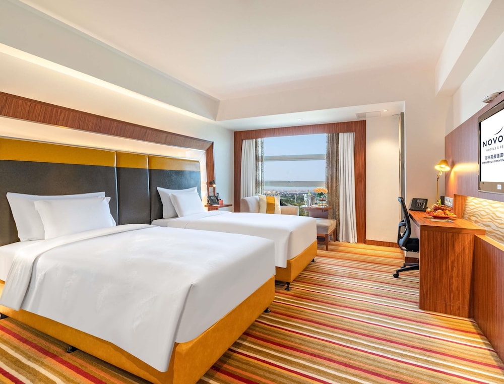 Habitación Premier Piso Ejecutivo con Dos Camas Individuales del hotel Novotel Zhengzhou Convention Centre. Foto 4