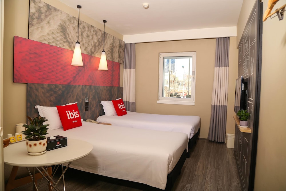 Habitación Deluxe con 2 camas individuales del hotel Ibis Tianjing Teda. Foto 1