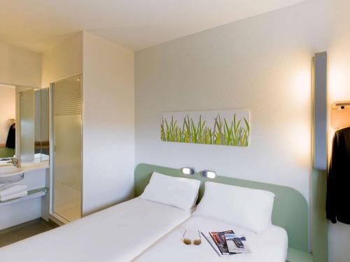 Habitación Doble Estándar - 2 camas del hotel Ibis Budget Madrid Getafe. Foto 12