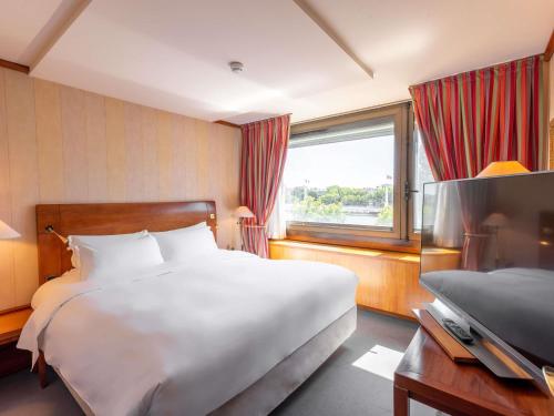 Suite Junior con vistas al río del hotel Sofitel Lyon Bellecour. Foto 4