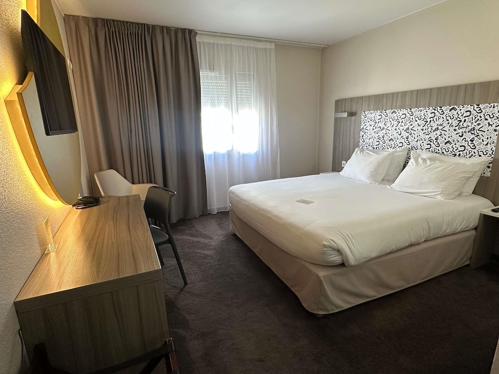 Habitación Estándar - 1 cama doble del hotel Ibis Styles Lyon Gorge de Loup Saphir. Foto 7