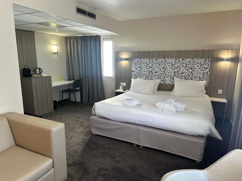 Habitación Confort - 1 cama doble y 1 sofá - cama del hotel Ibis Styles Lyon Gorge de Loup Saphir