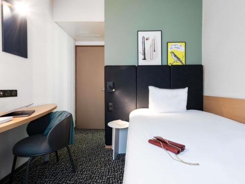Habitación Estándar con 1 cama individual del hotel ibis Paris Grands Boulevards Opéra 9e. Foto 1