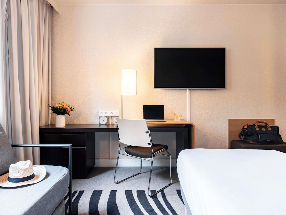Habitación estándar con 2 camas individuales del hotel Novotel Atria Nimes Centre. Foto 1