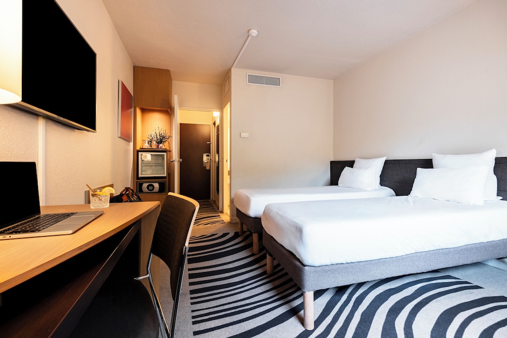 Habitación estándar con 2 camas individuales del hotel Novotel Atria Nimes Centre. Foto 5