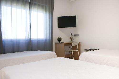 Habitación Triple del hotel Hospedium Castilla. Foto 3