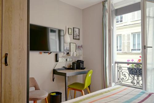 Habitación Triple Deluxe del hotel Litteraire Marcel Ayme, BW Premier Collection