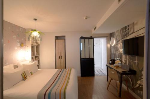 Apartamento con cama extragrande y cocina del hotel Litteraire Marcel Ayme, BW Premier Collection. Foto 7