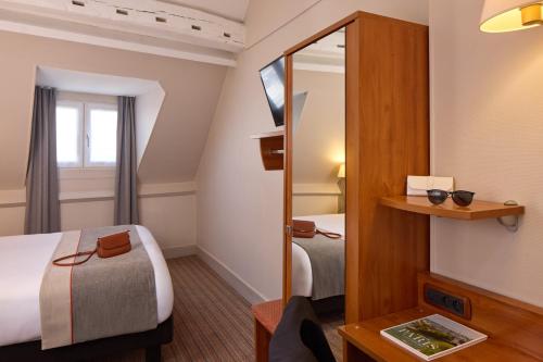 Habitación Doble del hotel Timhotel Le Louvre. Foto 9