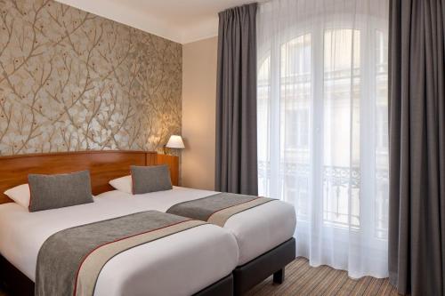 Habitación Doble Confort - 2 camas del hotel Timhotel Palais Royal. Foto 4