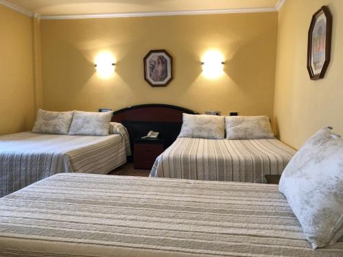 Habitación Cuádruple del hotel Sena. Foto 1
