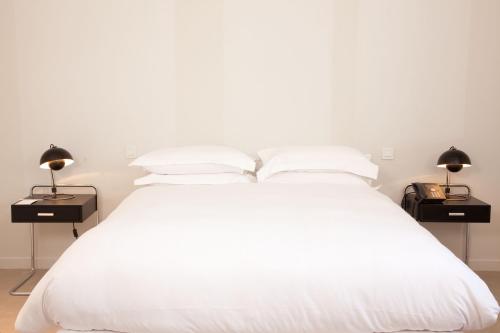 Habitación Doble Deluxe Couture del hotel La Maison Champs Elysées. Foto 6