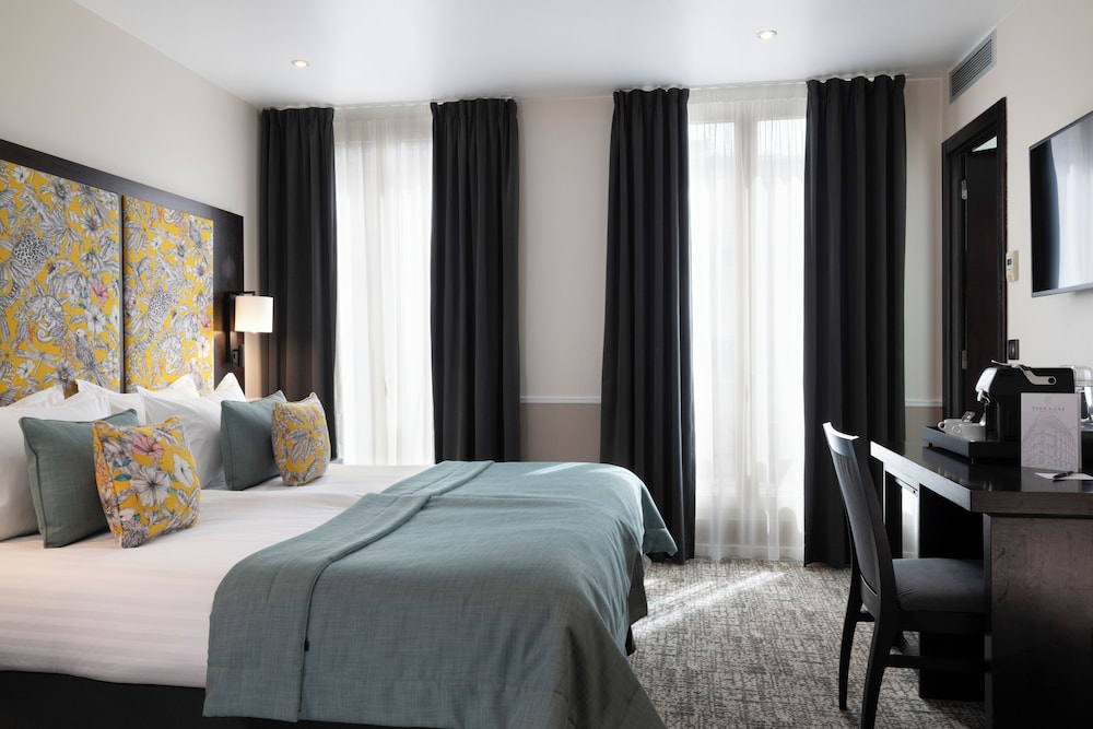 Habitación Deluxe con 2 camas individuales del hotel Park Lane Paris. Foto 9