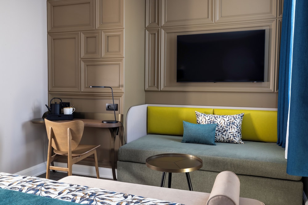 Habitación triple Deluxe del hotel L'Ormaie & Spa. Foto 4