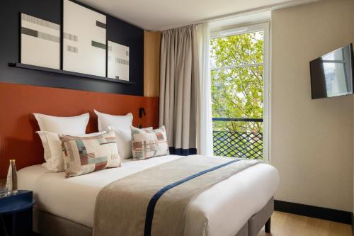 Habitación Doble Clásica del hotel Raspail Montparnasse. Foto 1