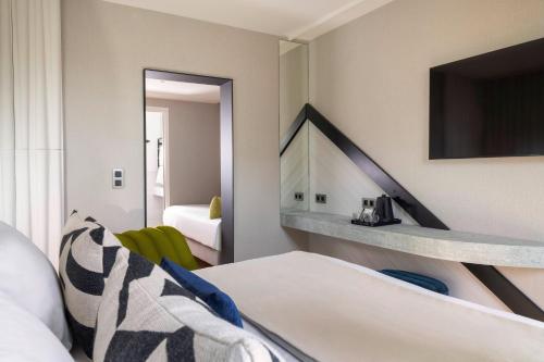 Habitación Triple del hotel Raspail Montparnasse. Foto 1