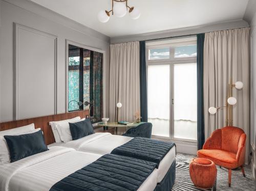 Habitación Signature con 2 camas individuales del hotel M Social Paris Opera