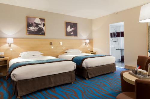 Habitación Doble Clásica con 2 camas dobles del hotel Mercure Paris 19 Philharmonie La Villette. Foto 2