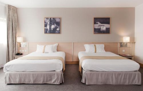 Habitación Doble Clásica con 2 camas dobles del hotel Mercure Paris 19 Philharmonie La Villette. Foto 6