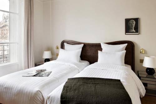 Habitación Twin Clásica del hotel Rochechouart - Orso Hotels. Foto 2