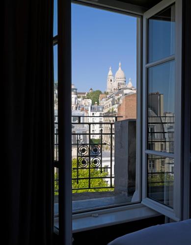Habitación Clásica con Vista al Sacré - Cœur del hotel Rochechouart - Orso Hotels. Foto 5