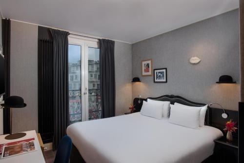 Habitación Familiar Comunicada del hotel NH Paris Opéra Faubourg. Foto 1