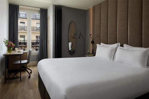 Habitación Familiar Comunicada del hotel NH Paris Opéra Faubourg. Foto 4