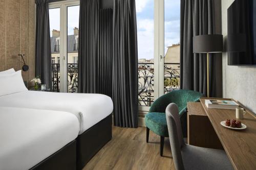 Habitación Familiar Comunicada del hotel NH Paris Opéra Faubourg. Foto 5