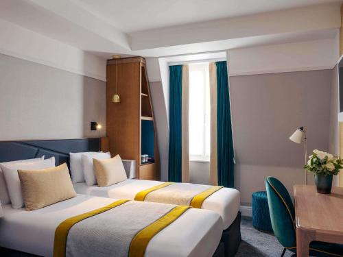 Habitación Doble Clásica - 2 camas del hotel Mercure Paris Opéra Garnier. Foto 2